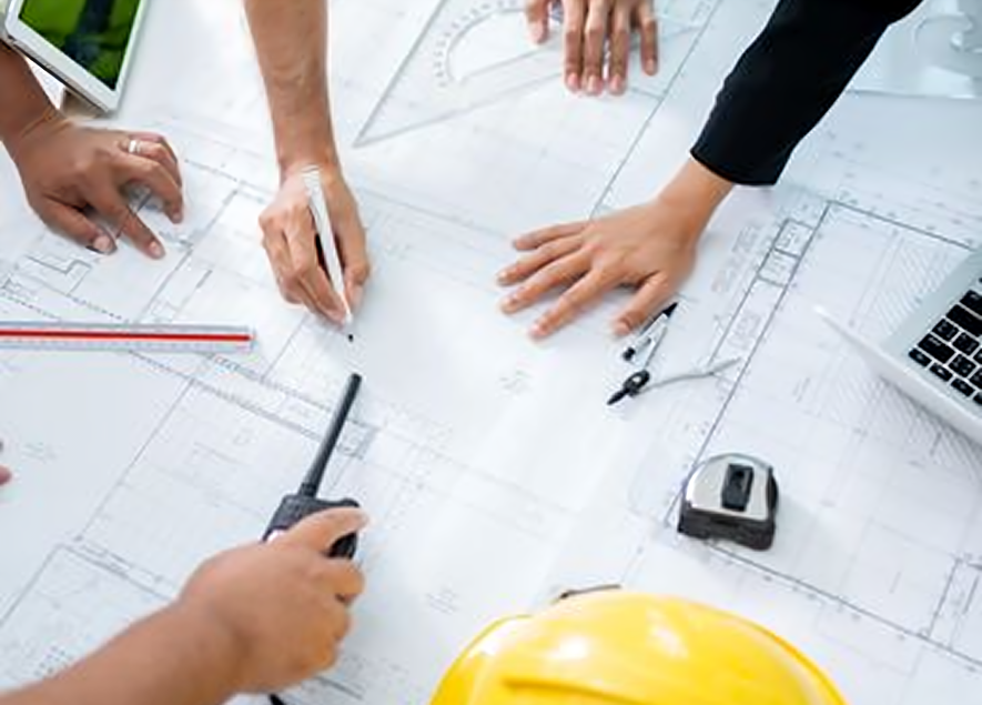 Architects discussing blueprints and planning