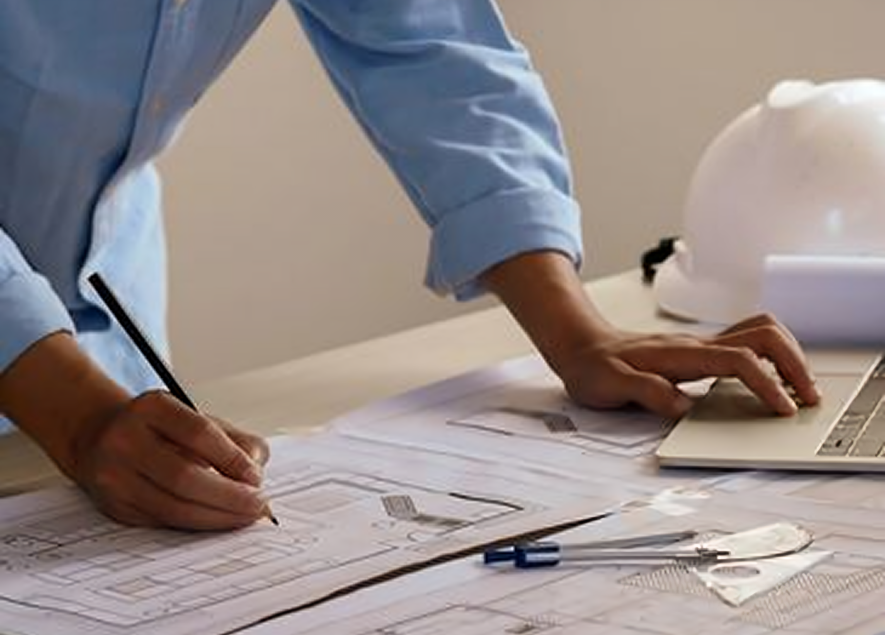 Designer drafting architectural project at desk