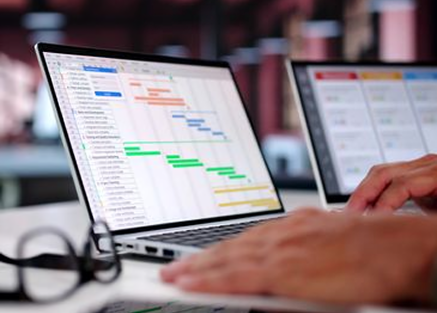 Laptop displaying project management software