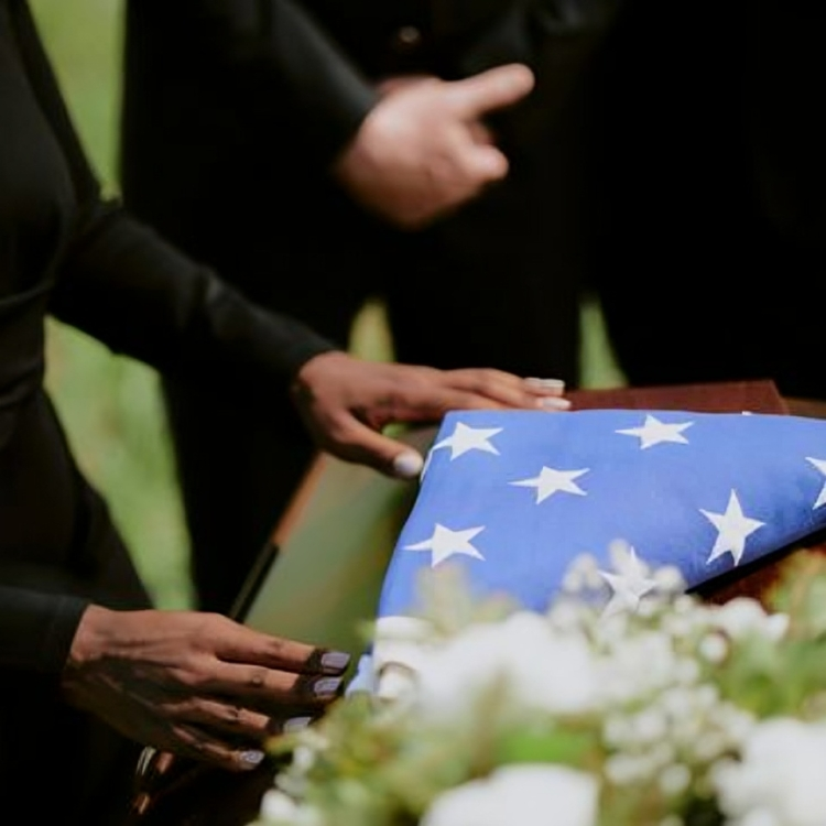 Memorial service with folded American flag