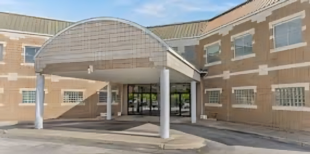 Building entrance with canopy and columns